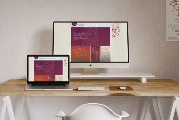 Two laptops displaying a typography based website design by Wonderlab.