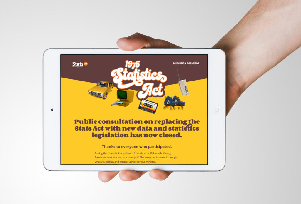 STATS_Ipad Hand holding a tablet with a retro-style public awareness website design by Wonderlab