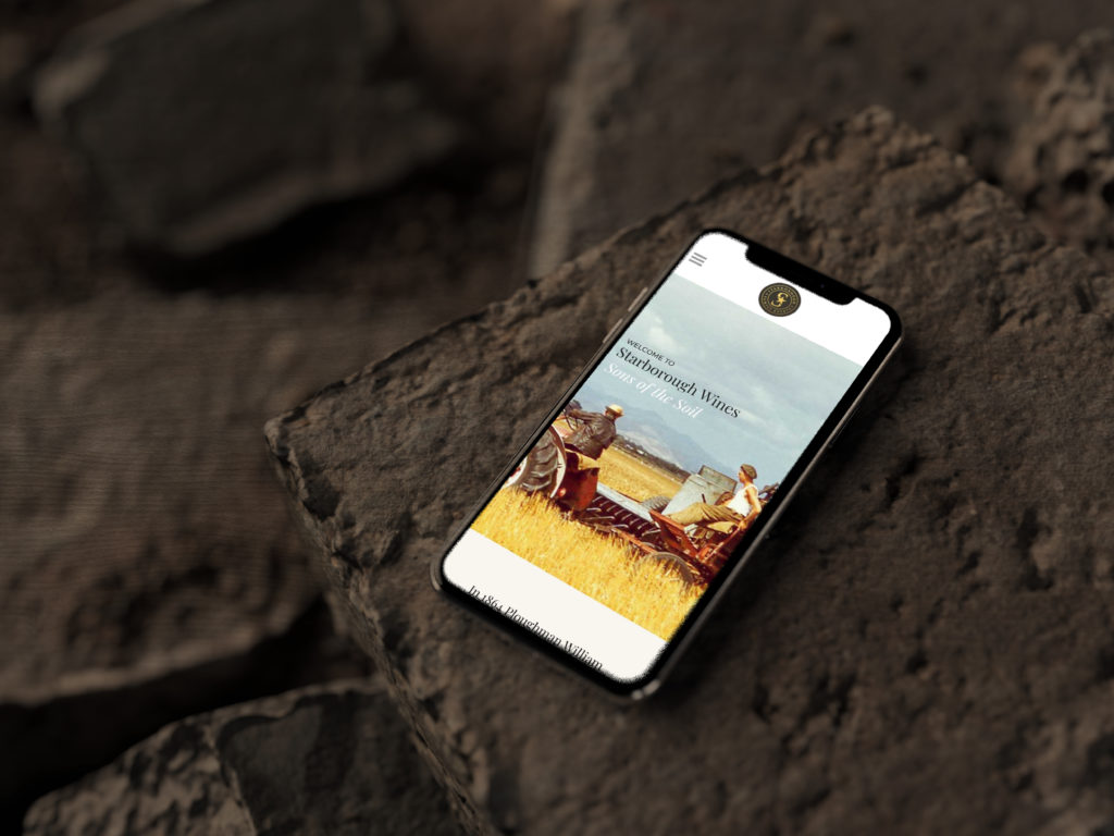 iPhone X on Ground Mockup by Anthony Boyd Graphics Mobile phone showing a mobile friendly brand design by Wonderlab