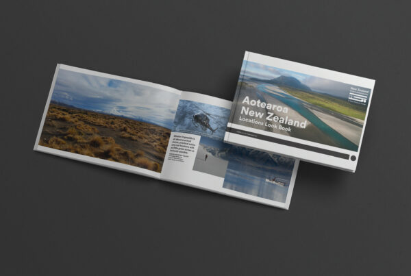 A new zealand travel brochure on a black background.