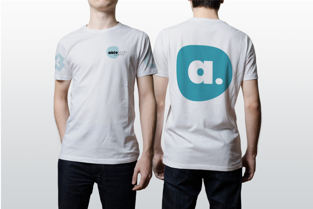 Artboard 1 copy Two models wearing corporate T-shirt branding by Wellington design agency Wonderlab