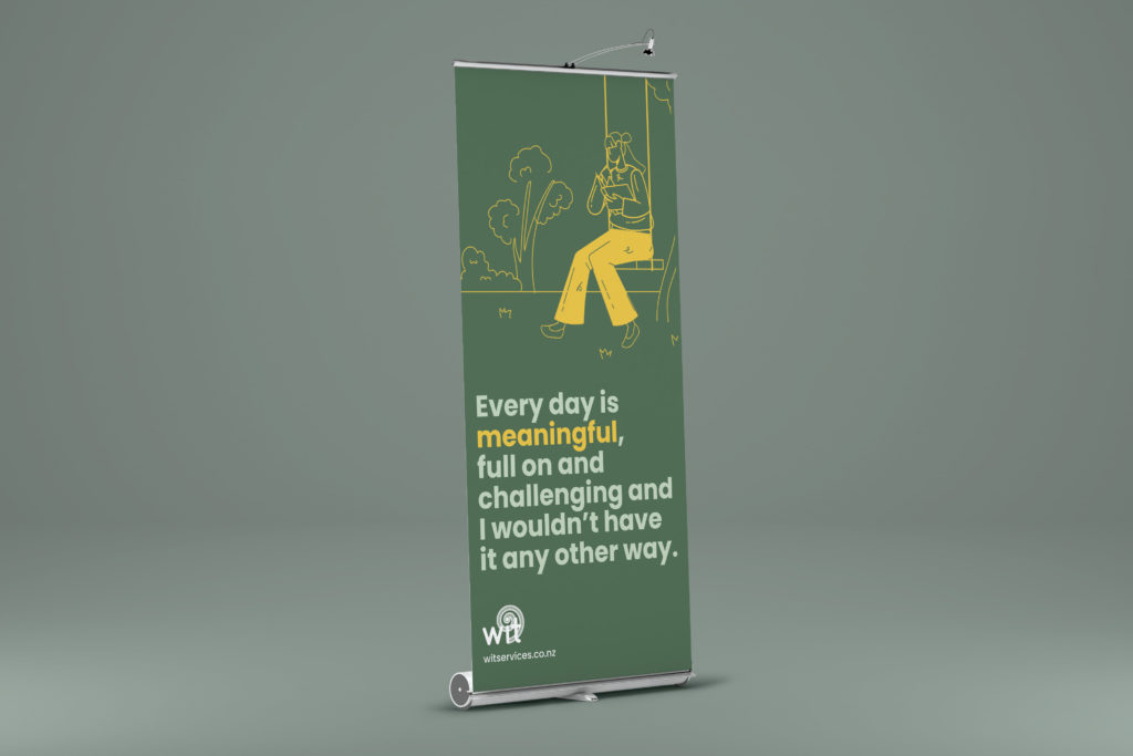 Wit Pull up Banner A roll up banner with an image of a man sitting on a bench.