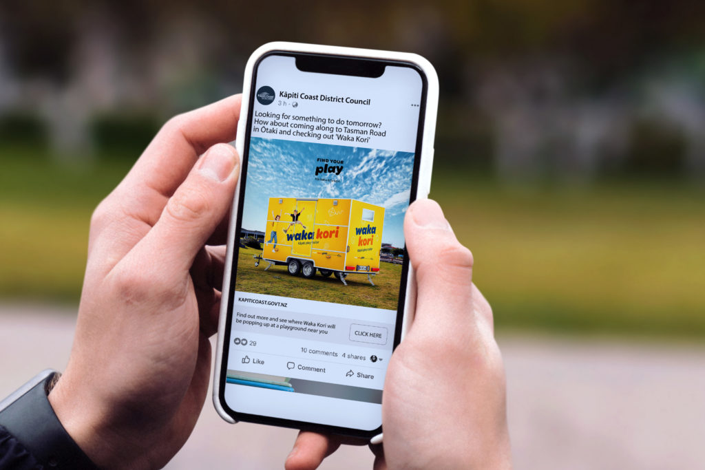 Find Your Play Wonderlab copy 9 Hand holding a mobile phone with a social media post by digital agency Wonderlab.