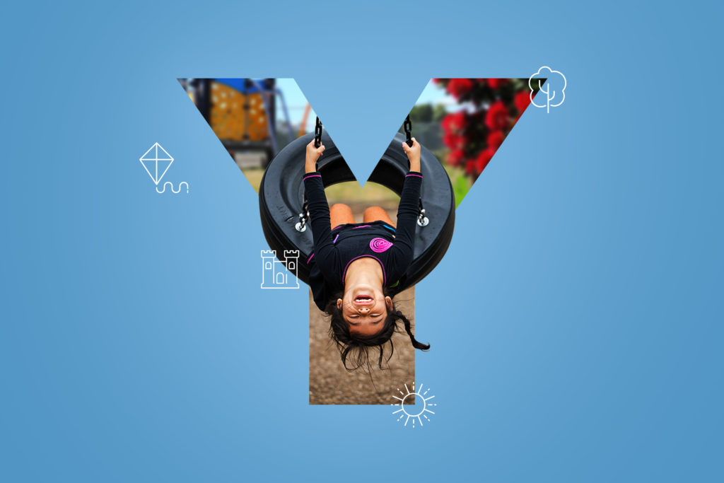 y The letter y with a girl laying on top of it.