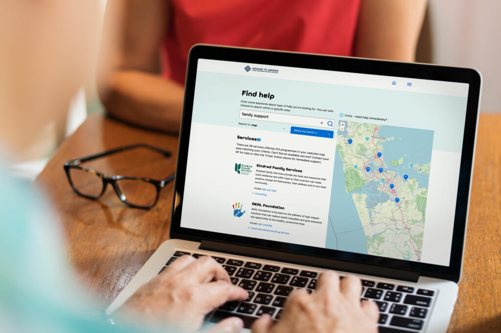 HPA_Alcohol_consultant-laptop A person is using a laptop with a map on it.