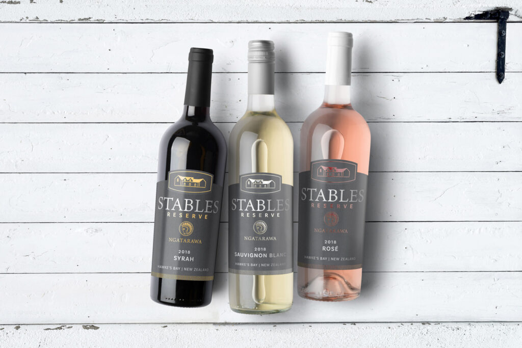 HERO_stables-multiple-bottles-layedflat Three bottles of wine on a white background.