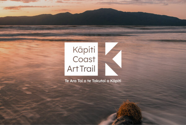 The brand identity for the Kāpiti Coast Art Trail overlaid on a seascape of Kāpiti Island.