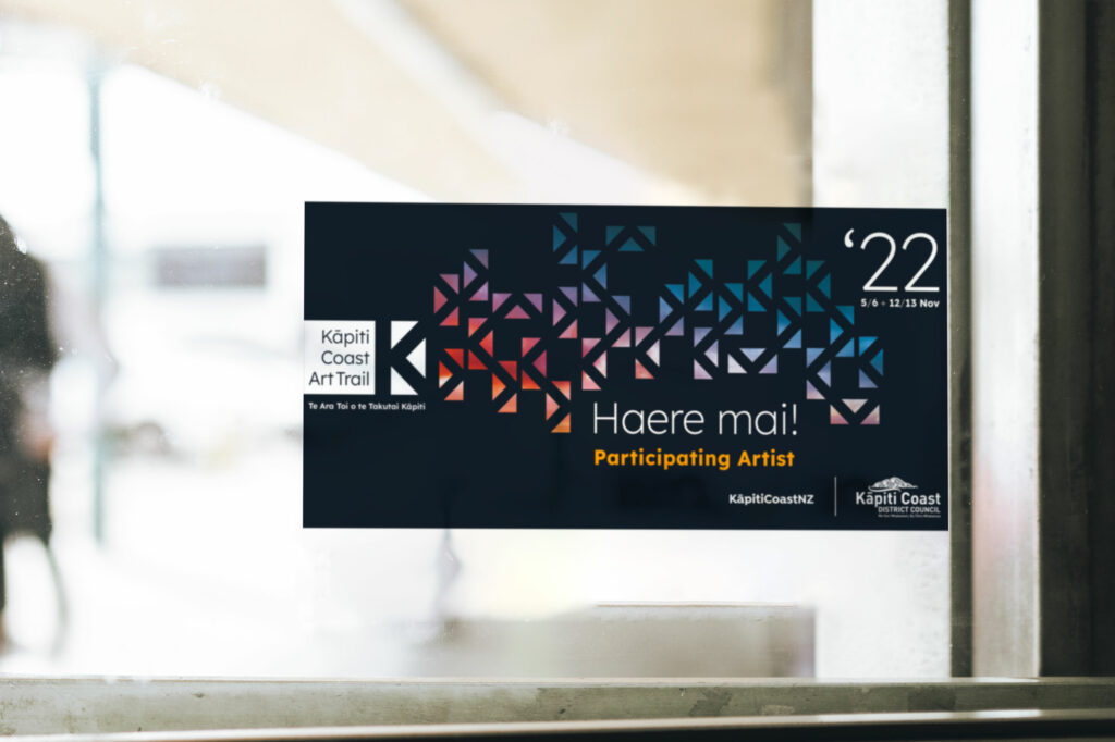 kcat_window-sticker-artist A poster with a message on it on a window.