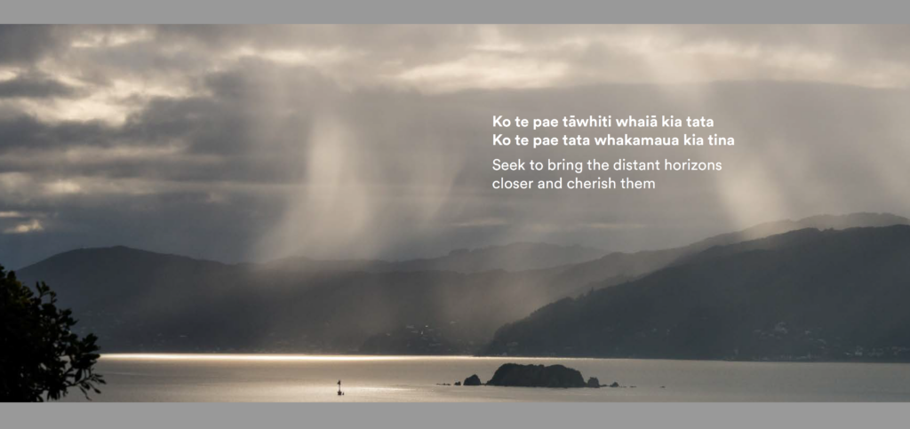 NZFC image only 2 The sun is shining over a lake with mountains in the background.