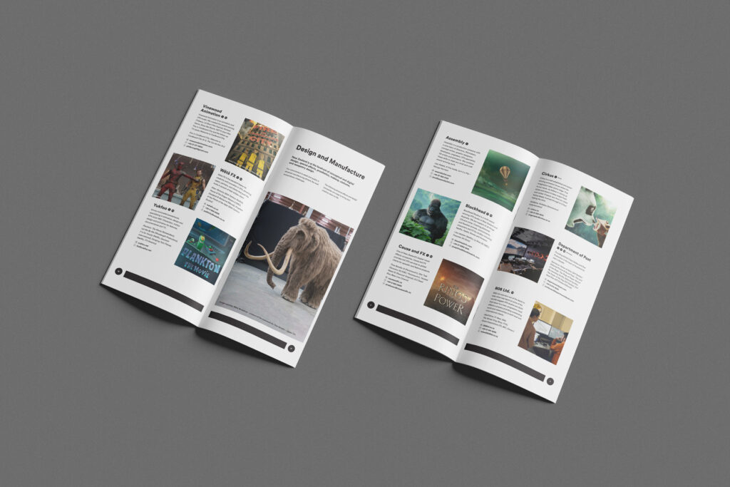 PDV-directory-content Open magazine on a gray surface featuring articles with images. One page shows a mammoth, while other pages include pictures of various illustrations and designs. Text and images vary in layout, showcasing different themes and topics.