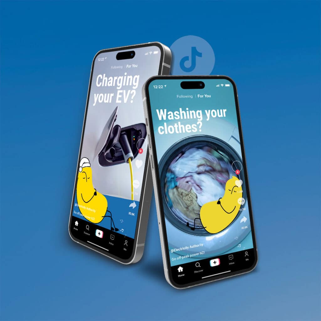 Tik Tok for high engagement Two smartphones display TikTok Electricity Authority videos. One shows an electric vehicle charging, and the other shows a washing machine in use. Both screens feature a yellow cartoon character and white text on a blue background.